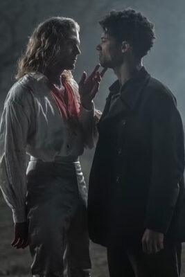 A bloody Lestat (Sam Reid) touches the chin of Louis (Jacob Anderson)