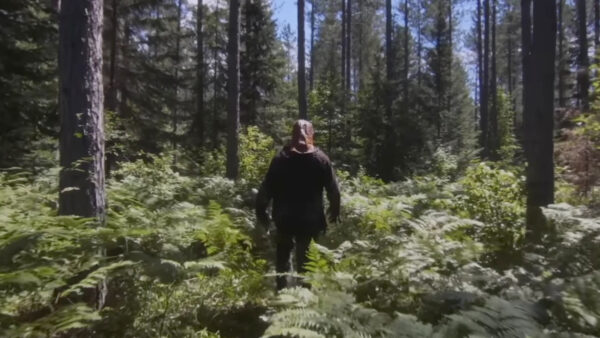 Johnny (Ry Barrett) walks through the woods