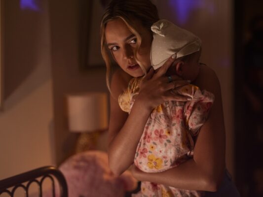 Imogen (bailee-madison) clutches a baby in a shadowy room