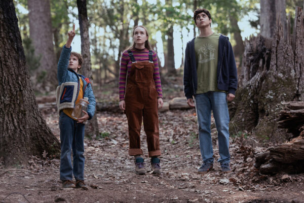 Arlo (Caleb Dolden - L) points to the sky as Meryl (Emilie Bierre) and Nicholas (Luciano Leroux - R) stare up in the woods