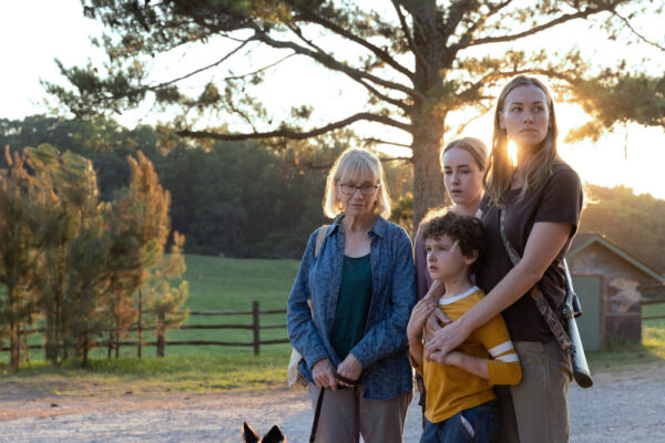 Ellen (Kathy Baker) stands next to Maggie (Yvonne Strahovski) who hugs children Arlo (Caleb Dolden) and Meryl (Emilie Bierre)