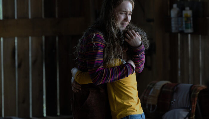 Meryl (Emilie Bierre) hugs Arlo (Caleb Dolden)