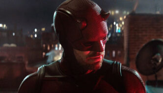 A close-up of Daredevil's face, his head cocked to the side, listening